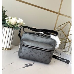 L.V. NWOT monogram coated canvas & Taiga leather crossbody in metallic gunmetal.